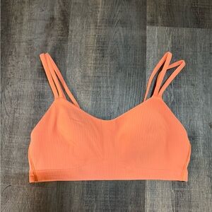 Lululemon Like a Cloud Ribbed Bra in the color Coral Kiss